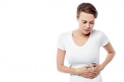 a person holding their stomach, gas trouble caused by yogurt and cultured milk