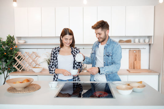 a couple in the kitchen