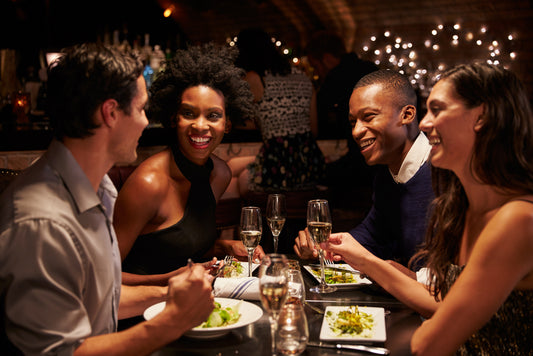 two couples dining