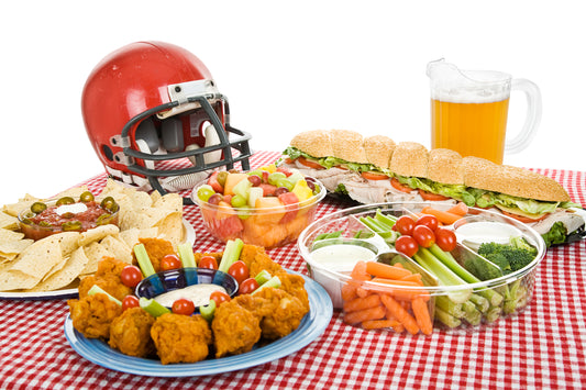 food, beer, and a football helmet on a table