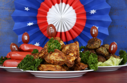 Football party buffet arranged with red/white/blue decoration in background
