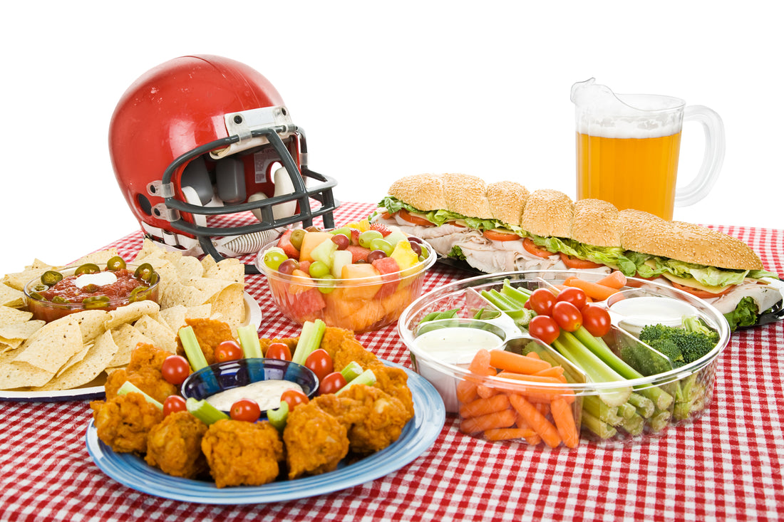 food, beer, and a football helmet on a table