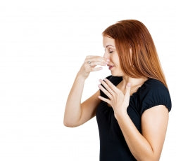 woman holding nose
